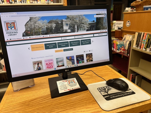 a computer monitor on a desk.