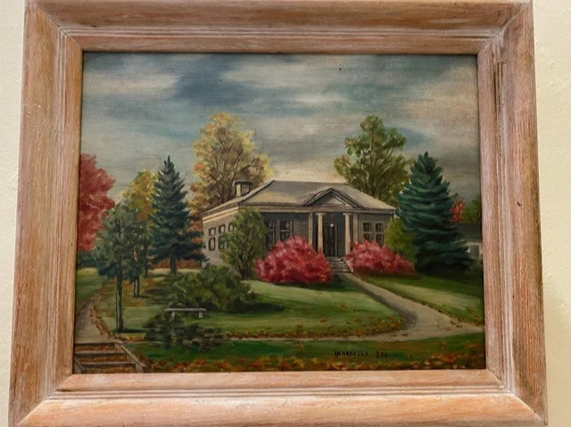 framed painting of a house with columns, surrounded by trees and vibrant autumn foliage under a partly cloudy sky.