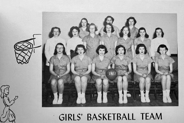 black and white group photo of a girls’ basketball team from 1953, with 14 girls in uniforms posing indoors, accompanied by drawings of a basketball hoop and a girl.