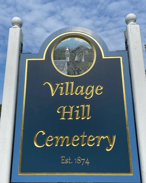 a blue and gold sign reads 