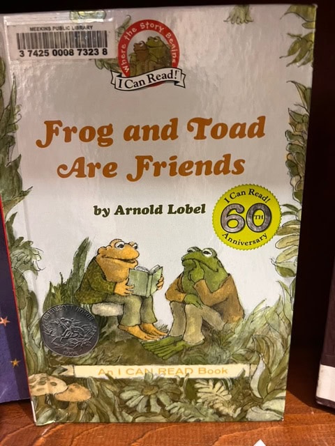 cover of the book "frog and toad are friends" by arnold lobel, showing two illustrated frogs sitting and reading together, with a 60th anniversary seal.