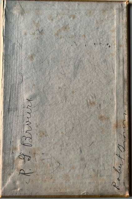 a sheet of aged, stained paper with handwritten signatures reading "r. g. burns" and "robert burns" visible on the surface.