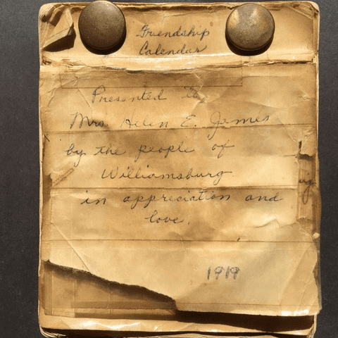 a worn, yellowed paper titled "friendship calendar," presented to mrs. helen e. james by the people of williamsburg in 1919, with handwritten text and tape repairs.