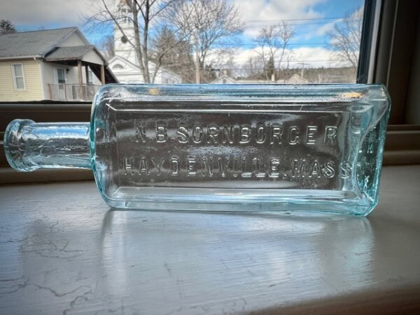 The bottle laying horizontally.