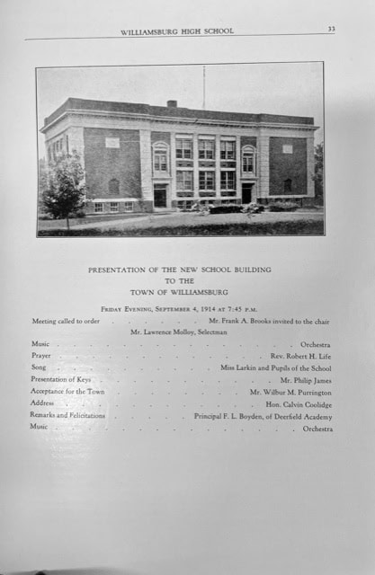 black and white photo of williamsburg high school above a printed program for the presentation of the new school building to the town, dated september 1914.
