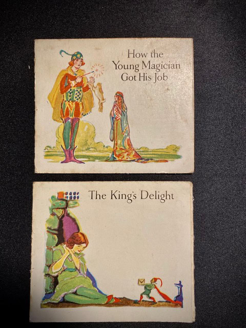 two illustrated story cards: the top shows a magician and a kneeling woman with the title "how the young magician got his job"; the bottom shows a woman kneeling by a tower, titled "the king's delight".