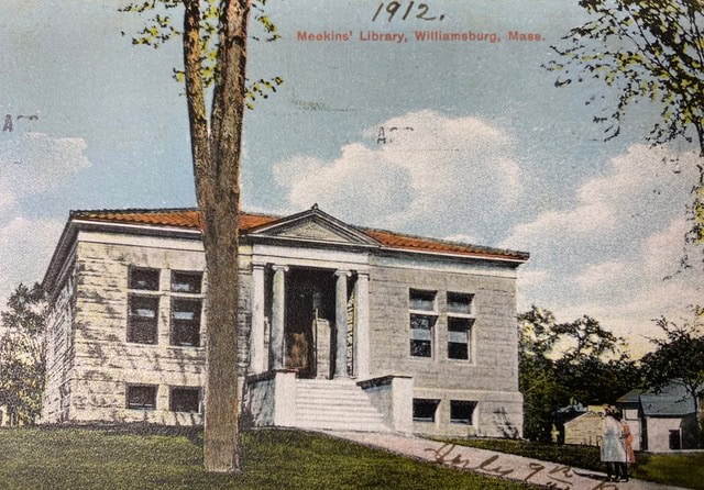 historic postcard of a stone library building with columns and steps, labeled "meekins library, williamsburg, mass.” and dated 1912. two people are visible near the entrance.