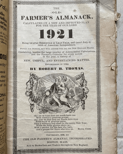 title page of "the old farmer’s almanack" for 1921, featuring detailed decorative borders, an illustration, and publication information by robert b. thomas.