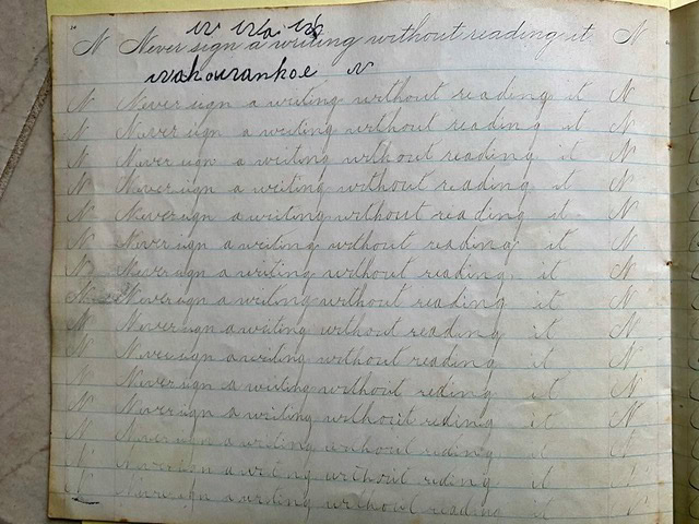 a lined notebook page showing repeated cursive handwriting practice of the sentence “i have sign a writing without reading it.”.