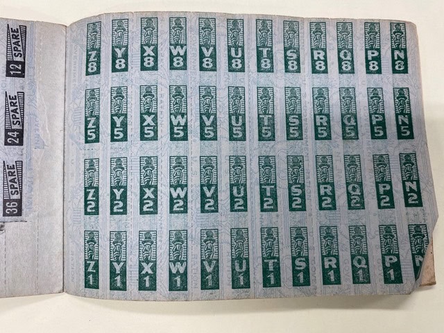 a page from a ration book shows multiple rows of green ration stamps labeled with letters and numbers, such as "z 8," "y 8," and "x 5," arranged in columns.