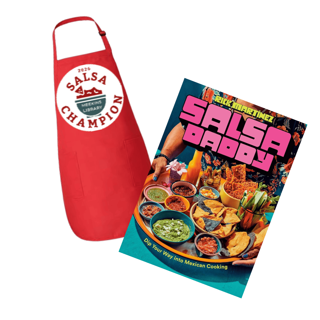 a red apron with a “2026 salsa champion” badge next to a colorful cookbook titled “salsa daddy,” featuring various salsa dishes on its cover.