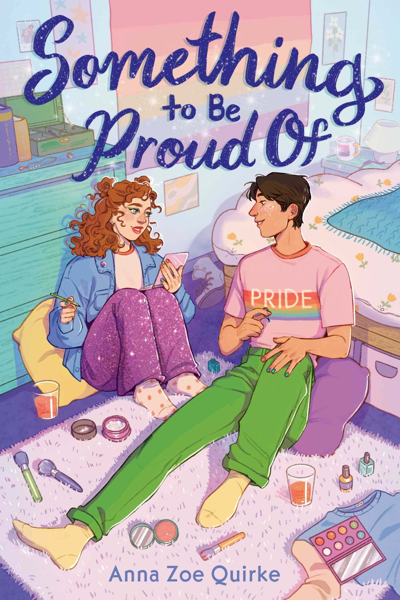 illustration of two teens sitting on a bedroom floor surrounded by makeup. one wears a "pride" shirt; the other holds a makeup brush. the title reads "something to be proud of.