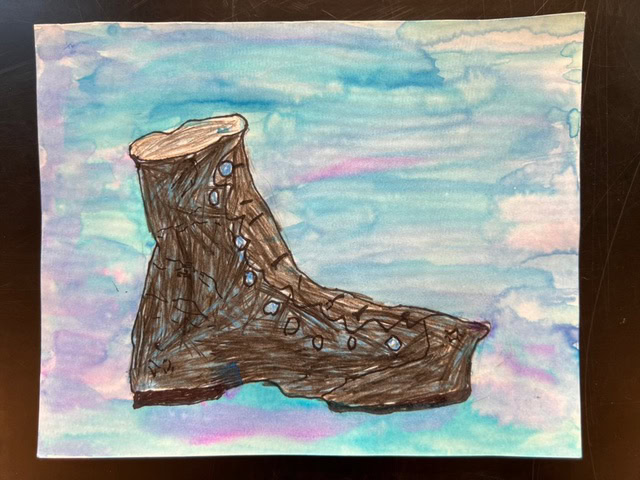child’s painting of a brown boot with blue dots against a blue and purple watercolor background.