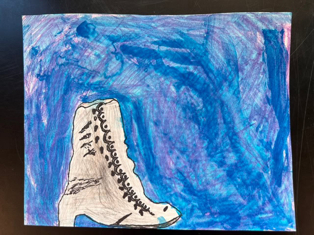 a drawing of a gray rock or landmass with black markings, surrounded by a textured blue and purple background suggestive of water.