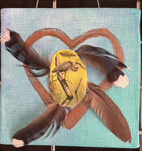 mixed media artwork featuring a painted heart, four bird feathers arranged in a star pattern, and a cutout image of a bird on a yellow background at the center.